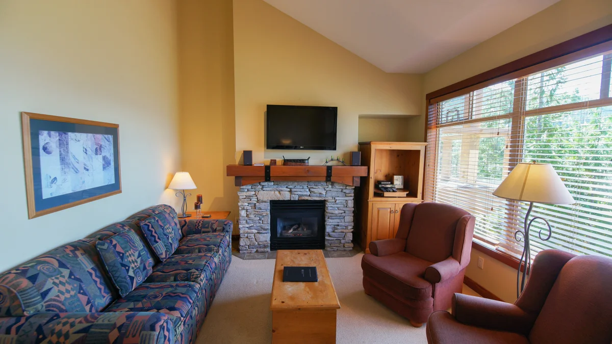 Living area with fireplace and TV