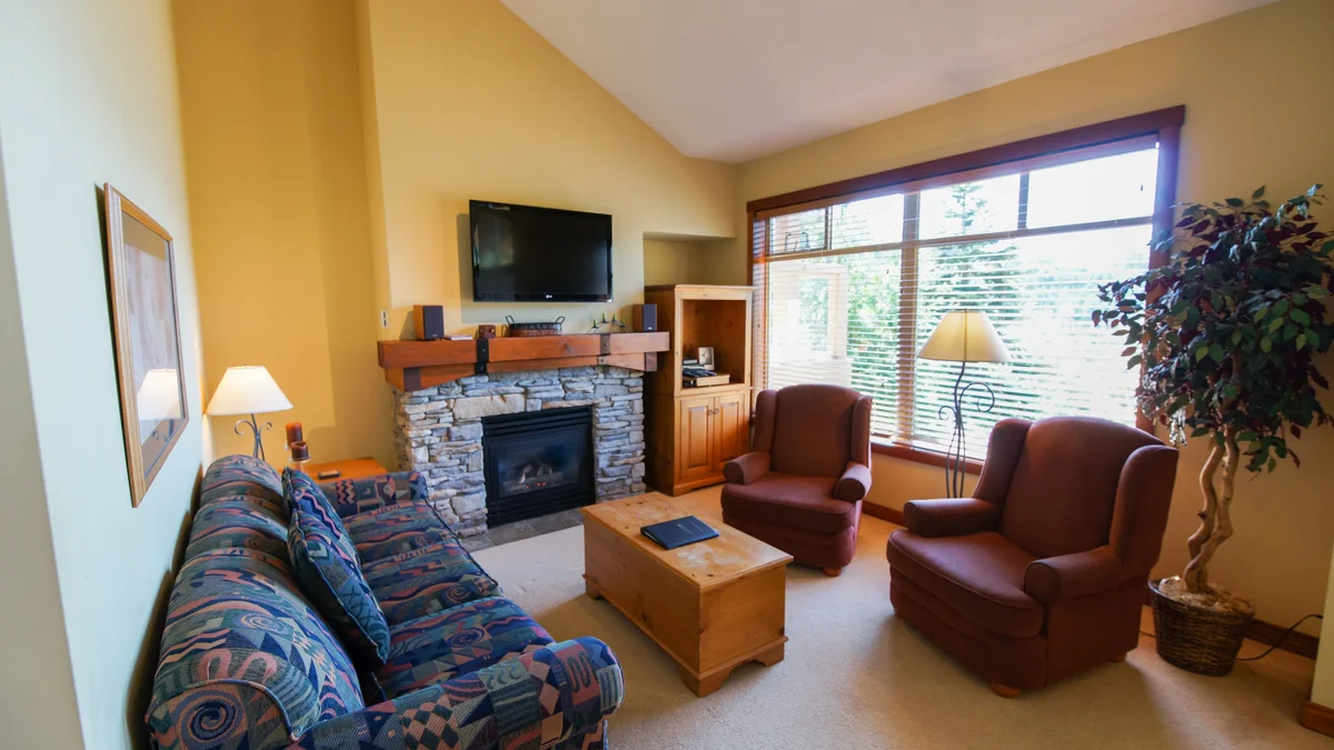 Living area with fireplace and TV