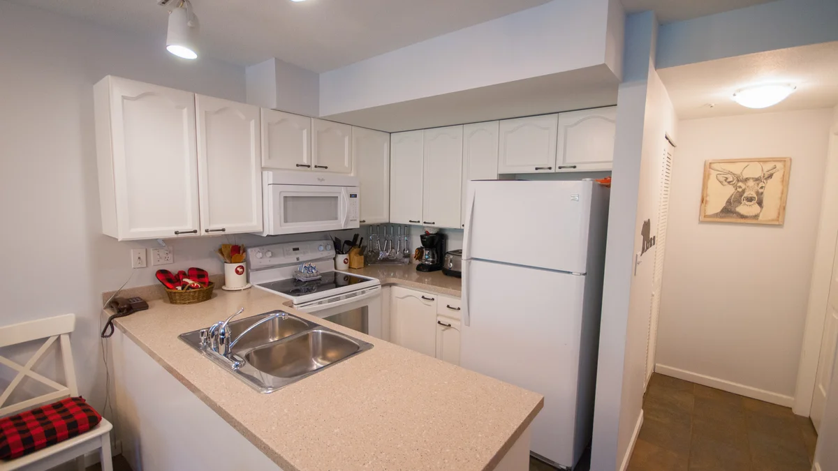 Behind the kitchen there is ensuite laundry and a half washroom