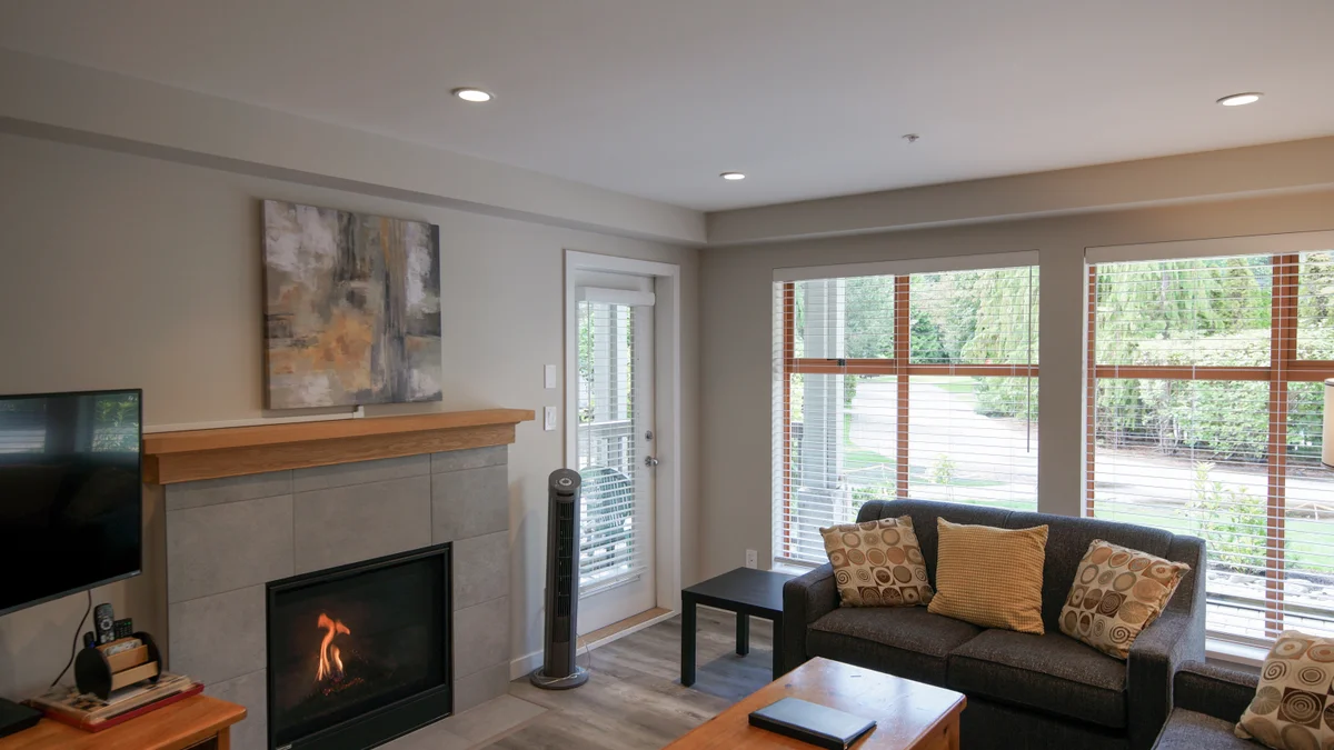 Living area with fireplace and TV