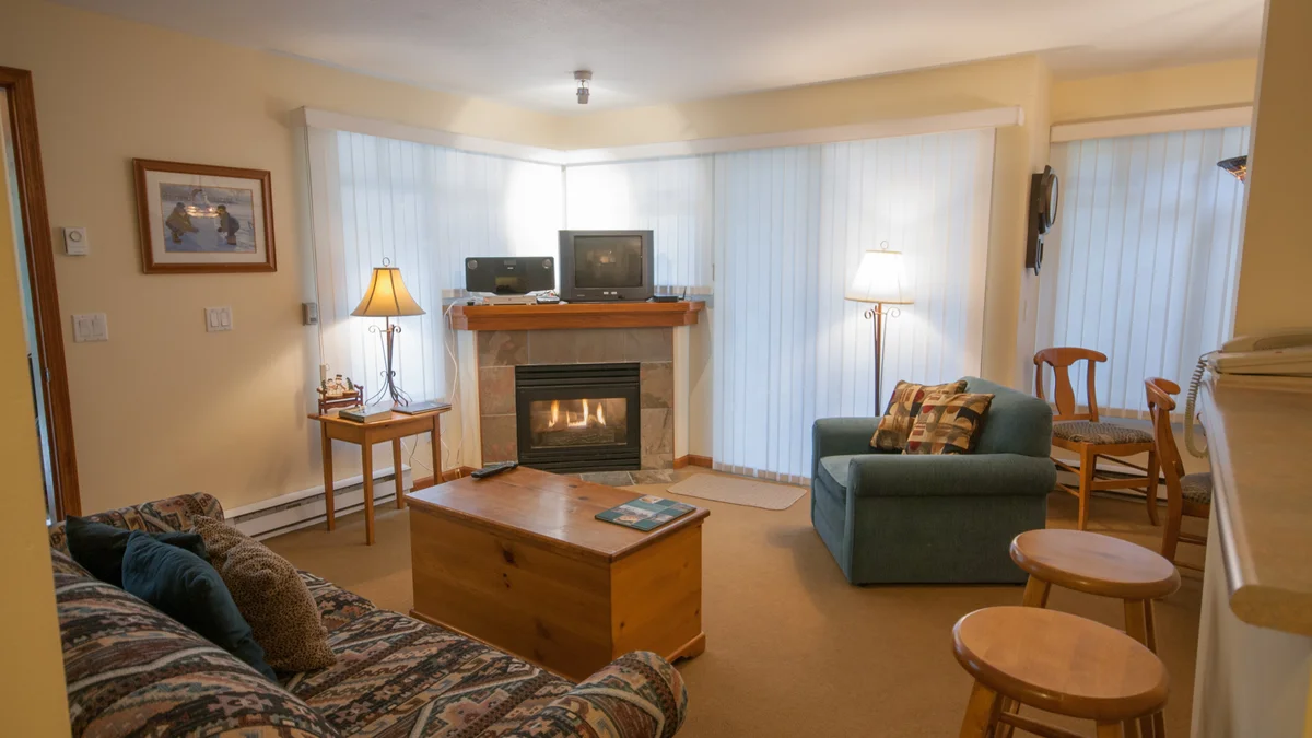 Cozy living area with fireplace and TV